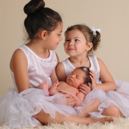 three daughters having the third child professional baby photography newborn photography